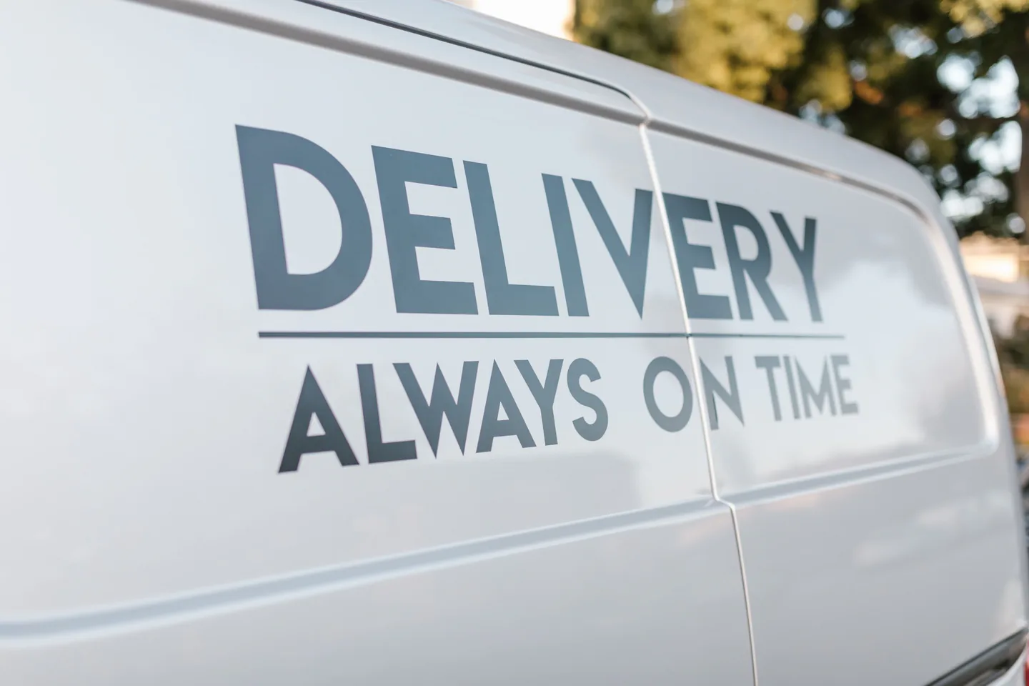 Commercial delivery vehicle with applied large-format vehicle branding.