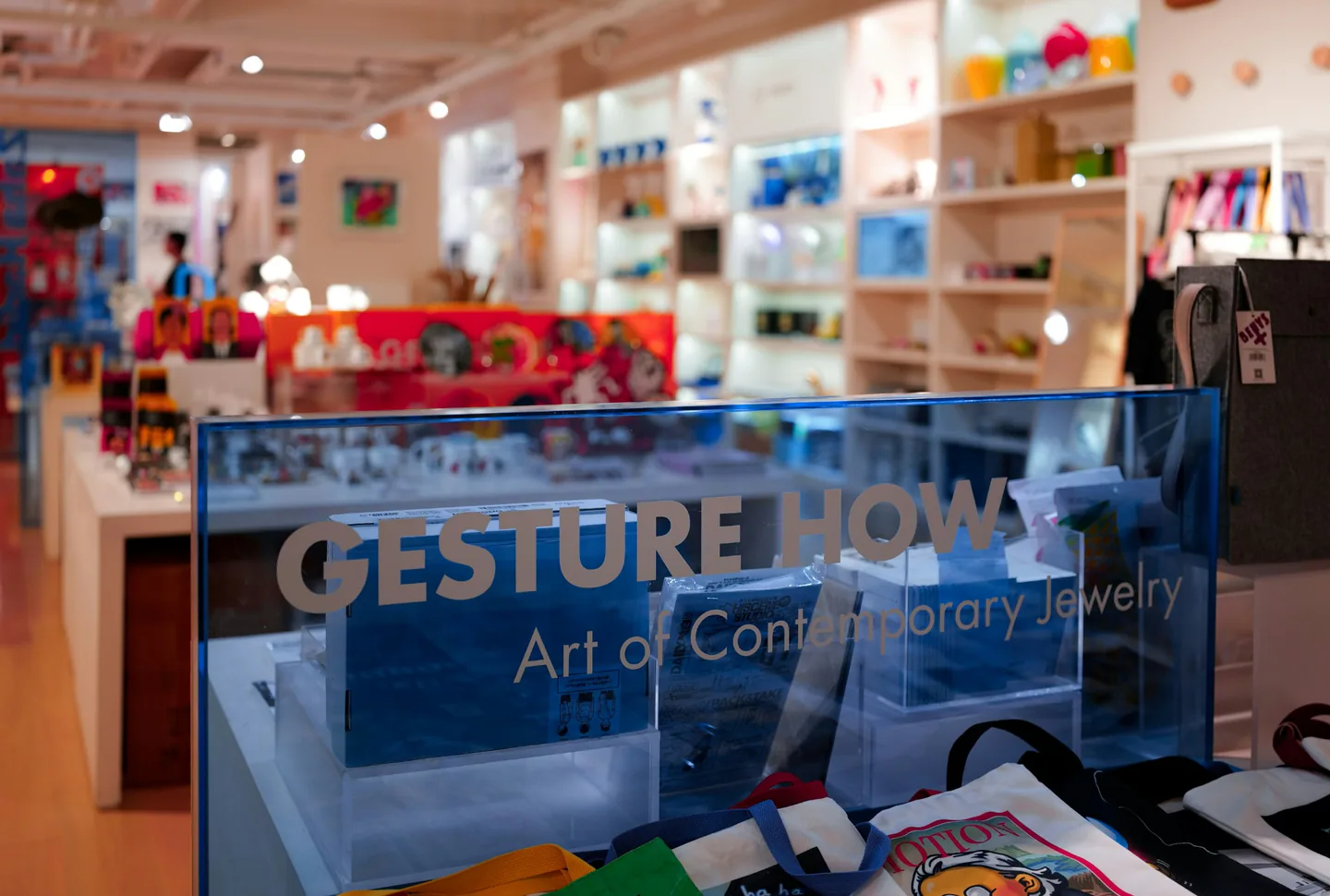 Retail display with acrylic display pieces and signage elements in a store environment.