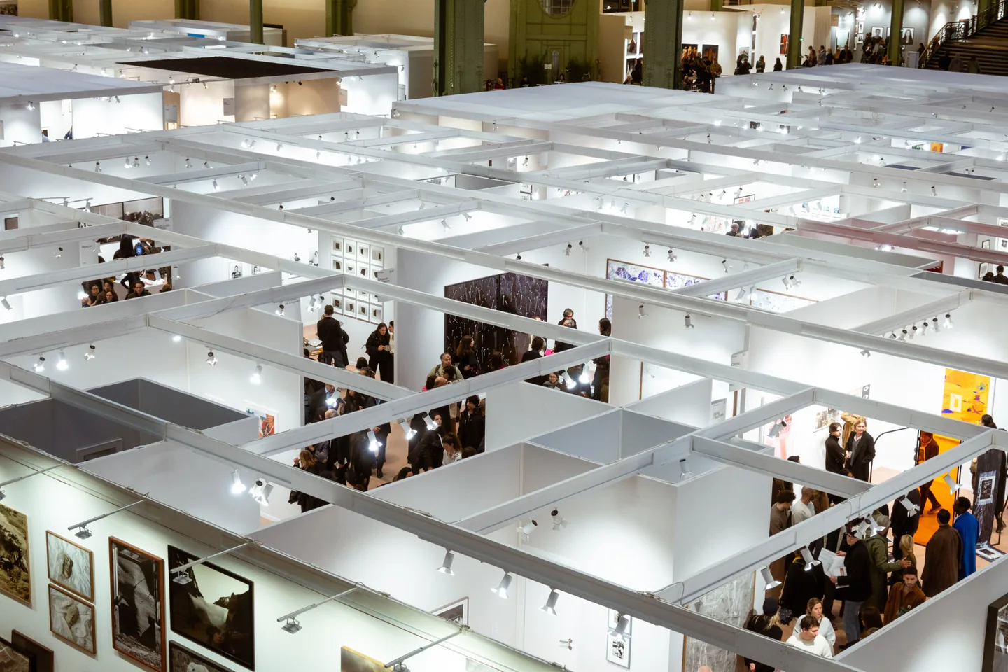 Large exhibition hall with multiple display booths and branded spaces.