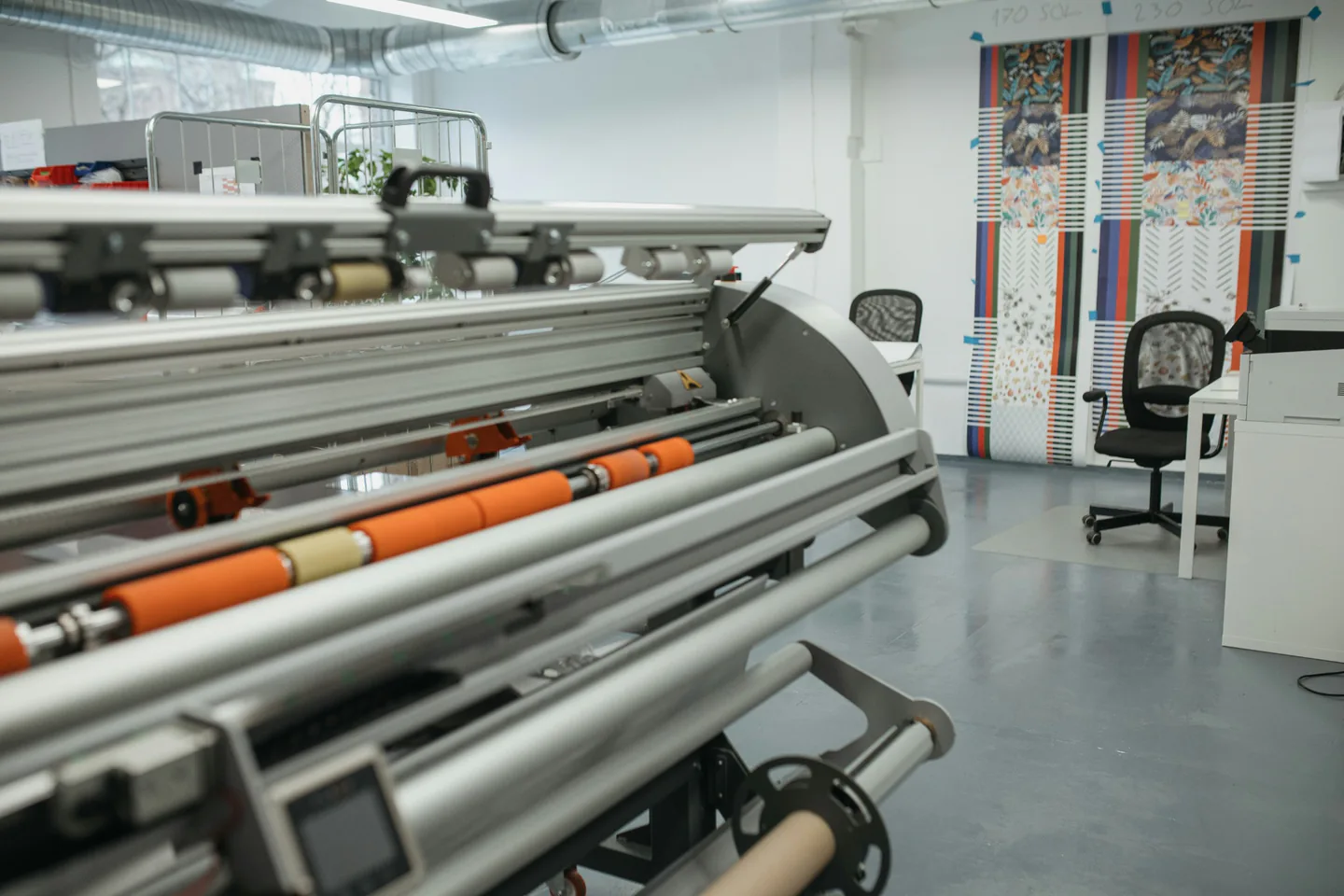 Print finishing equipment in a production workshop.