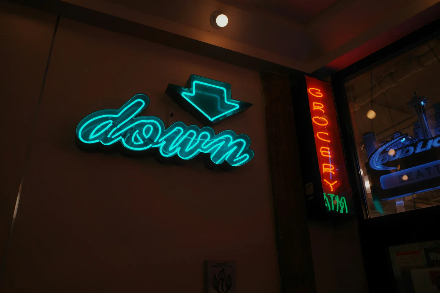 Illuminated neon signage installed inside a commercial venue.